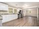 Kitchen with white cabinets and stainless steel appliances at 4079 Parks Ln, Douglasville, GA 30135