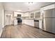 Modern kitchen featuring white cabinets and granite countertops at 4079 Parks Ln, Douglasville, GA 30135