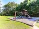 Community playground with swings, slide, and climbing structure at 104 Bridle Ct, Canton, GA 30114