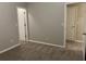 Neutral-toned bedroom with carpet and access to closets and other rooms at 1863 Roble Dr, Atlanta, GA 30349