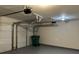 Two-car garage with automatic openers, epoxy flooring, and extra storage space at 1863 Roble Dr, Atlanta, GA 30349