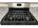 Stainless steel Frigidaire gas cooktop with five burners at 1863 Roble Dr, Atlanta, GA 30349