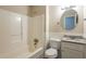 Bathroom featuring a tub/shower combo with a white surround and a white vanity with granite counter at 4547 Doral Sw Dr, Atlanta, GA 30331