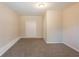 Neutral bedroom with carpet flooring, closet, and white trim at 4547 Doral Sw Dr, Atlanta, GA 30331