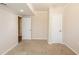 Bedroom featuring neutral walls, carpet, and two white doors at 4547 Doral Sw Dr, Atlanta, GA 30331