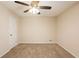 Neutral bedroom featuring a ceiling fan and neutral carpet and paint at 4547 Doral Sw Dr, Atlanta, GA 30331