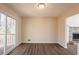Bright dining room with wood-look flooring, sliding glass door to deck, and access to the living room at 4547 Doral Sw Dr, Atlanta, GA 30331