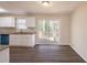 Kitchen featuring white cabinets, stainless steel appliances, granite counters, and access to the deck at 4547 Doral Sw Dr, Atlanta, GA 30331
