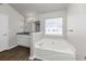 Modern bathroom with soaking tub and granite vanity at 508 Cascade Walk, Mcdonough, GA 30253