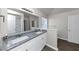 Bathroom with granite double vanity and large mirror at 508 Cascade Walk, Mcdonough, GA 30253