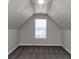 Cozy bedroom with grey carpet and a single window at 508 Cascade Walk, Mcdonough, GA 30253