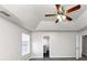 Primary bedroom with ceiling fan and grey carpet at 508 Cascade Walk, Mcdonough, GA 30253