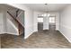 Spacious dining room with tile floors and a view of the staircase at 508 Cascade Walk, Mcdonough, GA 30253
