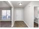 Bright entryway with tile floors, a half bathroom, and a view into another room at 508 Cascade Walk, Mcdonough, GA 30253