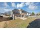 Tan house back with a patio, yard, and partial street view at 508 Cascade Walk, Mcdonough, GA 30253