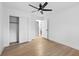 Simple bedroom with wood floors and ceiling fan at 520 Creekwood Xing, Roswell, GA 30076