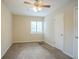 Bright bedroom with window, ceiling fan, and closet at 1728 W Austin Rd, Decatur, GA 30032