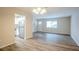 Open dining area with wood-look floors and kitchen view at 1728 W Austin Rd, Decatur, GA 30032