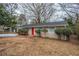 House exterior view, featuring a red front door and landscaping at 1728 W Austin Rd, Decatur, GA 30032
