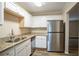 Modern kitchen featuring stainless steel refrigerator and granite countertops at 1728 W Austin Rd, Decatur, GA 30032