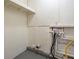 Simple laundry area with shelving and hookups at 1728 W Austin Rd, Decatur, GA 30032