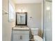 Modern bathroom with white cabinets, granite countertops, and a glass shower at 3197 Cloverhurst Dr, Atlanta, GA 30344