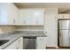 Bright kitchen featuring white cabinets, stainless steel appliances, and granite countertops at 3197 Cloverhurst Dr, Atlanta, GA 30344