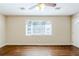 Open-concept living area with hardwood floors, neutral walls and lots of natural light at 3197 Cloverhurst Dr, Atlanta, GA 30344