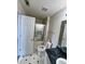 Bathroom with vinyl flooring, shower with sliding glass doors, toilet, and sink at 3745 Hudson Ct, Rex, GA 30273