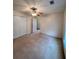 This bedroom features neutral walls, carpet flooring, a ceiling fan, and closet at 3745 Hudson Ct, Rex, GA 30273