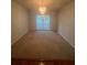 Cozy dining space with modern chandelier and a sliding glass door to the backyard at 3745 Hudson Ct, Rex, GA 30273
