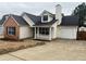 Charming single-Gathering home with a combination of brick and vinyl siding, plus attached garage at 3745 Hudson Ct, Rex, GA 30273