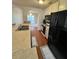 The kitchen features sleek black appliances, white cabinets, and a breakfast bar at 3745 Hudson Ct, Rex, GA 30273