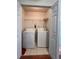 Functional laundry room with washer, dryer, wire shelving, and tile flooring at 3745 Hudson Ct, Rex, GA 30273
