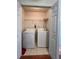 Practical laundry room with washer, dryer, and storage shelving at 3745 Hudson Ct, Rex, GA 30273