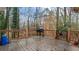 Wooden deck overlooking a wooded backyard with grill at 3870 N Shelby N Ln, Douglasville, GA 30135