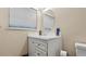Simple bathroom with white vanity and an oval mirror at 3870 N Shelby N Ln, Douglasville, GA 30135