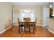 Bright dining room with hardwood floors and French doors leading outside at 3870 N Shelby N Ln, Douglasville, GA 30135