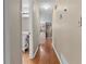 Bright hallway with hardwood floors leading to various rooms at 3870 N Shelby N Ln, Douglasville, GA 30135