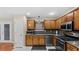 Kitchen boasts stainless steel appliances and wood cabinets at 3870 N Shelby N Ln, Douglasville, GA 30135