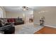 Comfortable living room, featuring a sectional sofa and hardwood floors at 3870 N Shelby N Ln, Douglasville, GA 30135