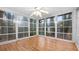 Sun-drenched sunroom with ample windows and wood flooring at 3870 N Shelby N Ln, Douglasville, GA 30135