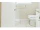 Clean bathroom with white vanity and marble-look tile floor at 2249 Clanton Ter, Decatur, GA 30034