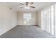 Bedroom with ceiling fan, window, and neutral carpeting at 2249 Clanton Ter, Decatur, GA 30034