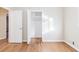 Bedroom with hardwood floors, closet, and access to other rooms at 2249 Clanton Ter, Decatur, GA 30034