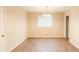Simple dining room with neutral walls and wood-look flooring at 2249 Clanton Ter, Decatur, GA 30034