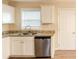 Kitchen with white cabinets, granite counters, and stainless steel appliances at 2249 Clanton Ter, Decatur, GA 30034