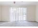 Bright living room featuring sliding glass doors and neutral carpeting at 2249 Clanton Ter, Decatur, GA 30034