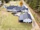 Aerial view showing house, detached garage, and expansive lawn at 5601 Atlanta Hwy, Rutledge, GA 30663