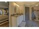 Bathroom with single vanity, patterned tile floor, and access to other rooms at 5601 Atlanta Hwy, Rutledge, GA 30663